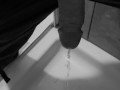 Taking a quick piss on the shower floor, with my semi hard cock