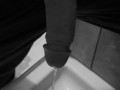 Taking a quick piss on the shower floor, with my semi hard cock