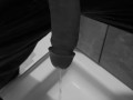 Taking a quick piss on the shower floor, with my semi hard cock