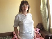 Charming brunette gracefully swaying her hips, showing off her appetizing forms.