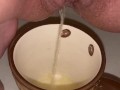 Girl pisses in a coffee cup