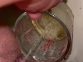 Girl measures her morning piss and overflows the cup