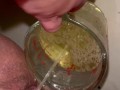 Girl measures her morning piss and overflows the cup