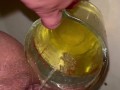Girl measures her morning piss and overflows the cup