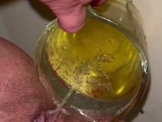 Girl measures her morning piss and overflows the cup