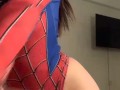 a beautiful girl in a spider-man costume
