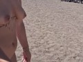 she walks completely naked on a public beach full of people
