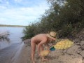 Nude girl and melon on the wild beach