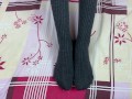 Girl in gray long socks on her legs caresses herself in bed
