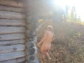 Nude girl walking in the village