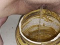 Girl pisses in 5lb jar of peanut butter