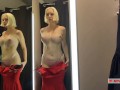 Naked girl with a big tits in the public locker room, try on transparent clothes