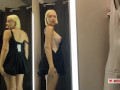 Naked girl with a big tits in the public locker room, try on transparent clothes