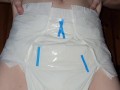 Diaper girl pees thick diaper
