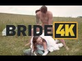 BRIDE4K. Pretty brunette bride fucks a horny shepherd in a summer field