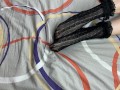 Caressing long legs of girl in black lace socks