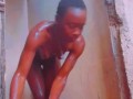 Sexy African Ebony Showers Outside While Neighbors Sing Next Door
