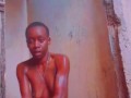 Sexy African Ebony Showers Outside While Neighbors Sing Next Door