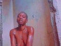Sexy African Ebony Showers Outside While Neighbors Sing Next Door