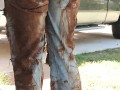 Rubbing mud all over my ripped denim jeans teasing you  clothing destruction