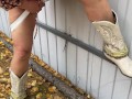 Milf in boots pees at the fence