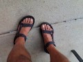 My male pedicured feet in sandals