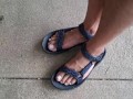 My male pedicured feet in sandals