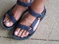My male pedicured feet in sandals