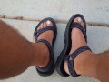 My male pedicured feet in sandals