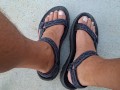 My male pedicured feet in sandals