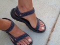 My male pedicured feet in sandals