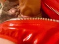 Red latex panties and a dildo