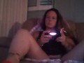 Busty Wife In Red Mini Dress Playing Video Games and Smoking Cigarettes