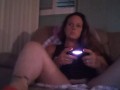Busty Wife In Red Mini Dress Playing Video Games and Smoking Cigarettes