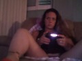 Busty Wife In Red Mini Dress Playing Video Games and Smoking Cigarettes