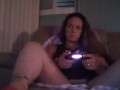 Busty Wife In Red Mini Dress Playing Video Games and Smoking Cigarettes