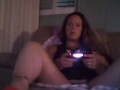 Busty Wife In Red Mini Dress Playing Video Games and Smoking Cigarettes