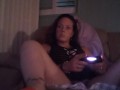 Busty Wife In Red Mini Dress Playing Video Games and Smoking Cigarettes