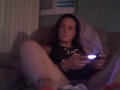 Busty Wife In Red Mini Dress Playing Video Games and Smoking Cigarettes