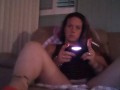 Busty Wife In Red Mini Dress Playing Video Games and Smoking Cigarettes
