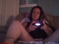 Busty Wife In Red Mini Dress Playing Video Games and Smoking Cigarettes