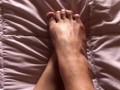 girl with hairy legs plays with her feet