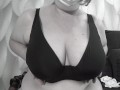 A mature BBW milf with big natural saggy tits tries on bras.