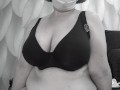 A mature BBW milf with big natural saggy tits tries on bras.