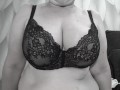 A mature BBW milf with big natural saggy tits tries on bras.