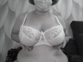 A mature BBW milf with big natural saggy tits tries on bras.