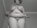 A mature fat milf with big natural saggy tits tries on panties.