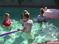 Four girls are enjoying stripping in the swimming pool, with one lucky guy joining them