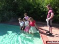 Four girls are enjoying stripping in the swimming pool, with one lucky guy joining them