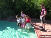 Four girls are enjoying stripping in the swimming pool, with one lucky guy joining them